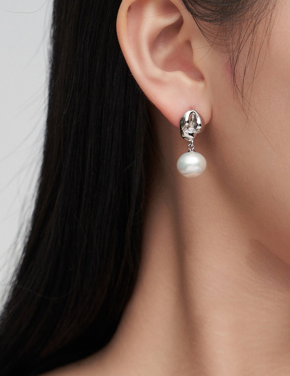 Playful Silver Pearl Earrings with Zircon Accent